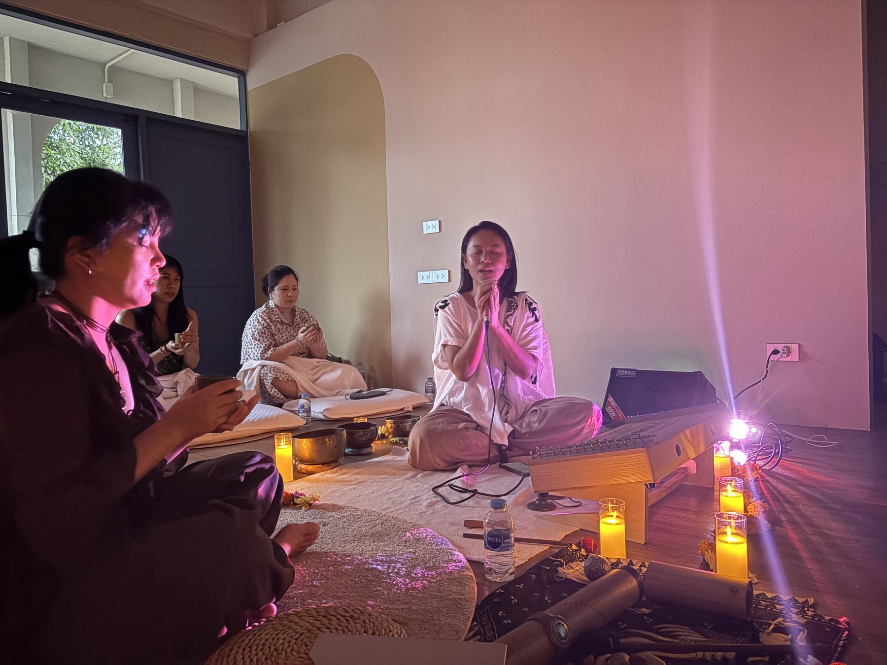 Guests and facilitators sharing a sound healing session at Soulwaves