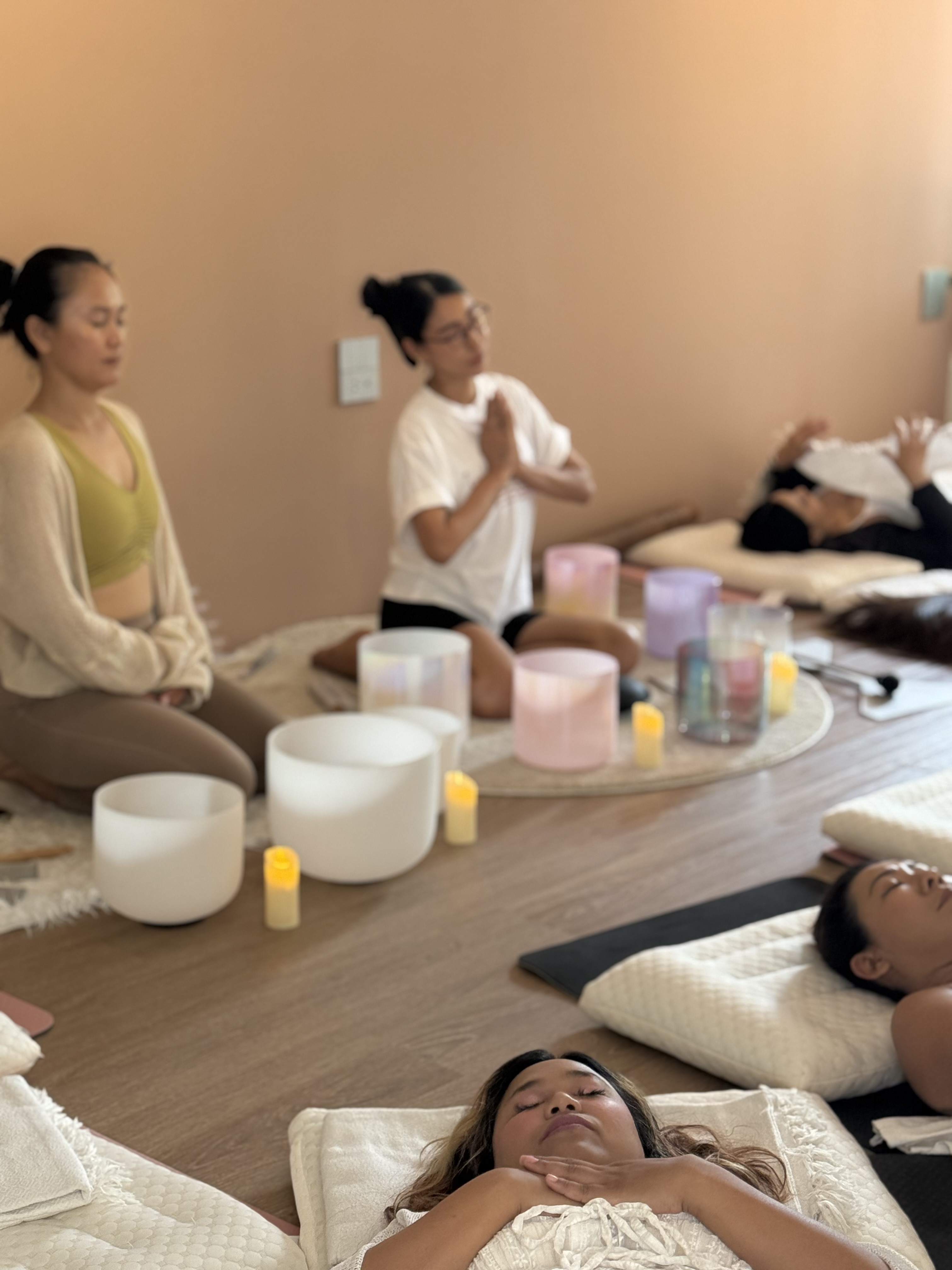 Guests resting during a sound healing session